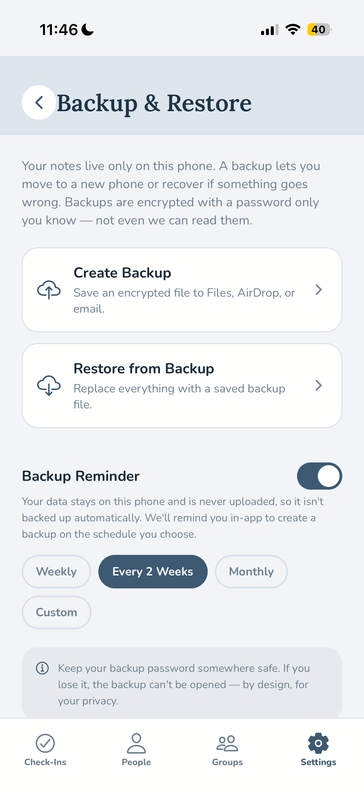 The Backup and Restore screen showing encrypted local backups and a reminder schedule